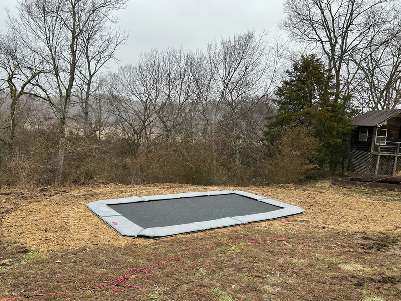 What materials contribute to the long-term durability of inground trampolines?